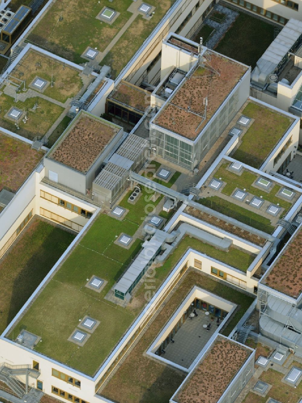 Aerial photograph Berlin - Building the shopping center Das Schloss (The Castle) in the Steglitz part of Berlin in Germany. The shopping mall consists of several levels which can be seen on its roof as well. It also includes a round glass roof and an old brick tower