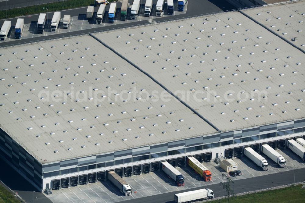 Aerial image Bönen - Building complex and grounds of the logistics center and central storage of Kik Textilien GmbH in Boenen in the state of North Rhine-Westphalia. The centre is located in the industrial area in the East of Boenen. It consists of a series of loading docks for trucks