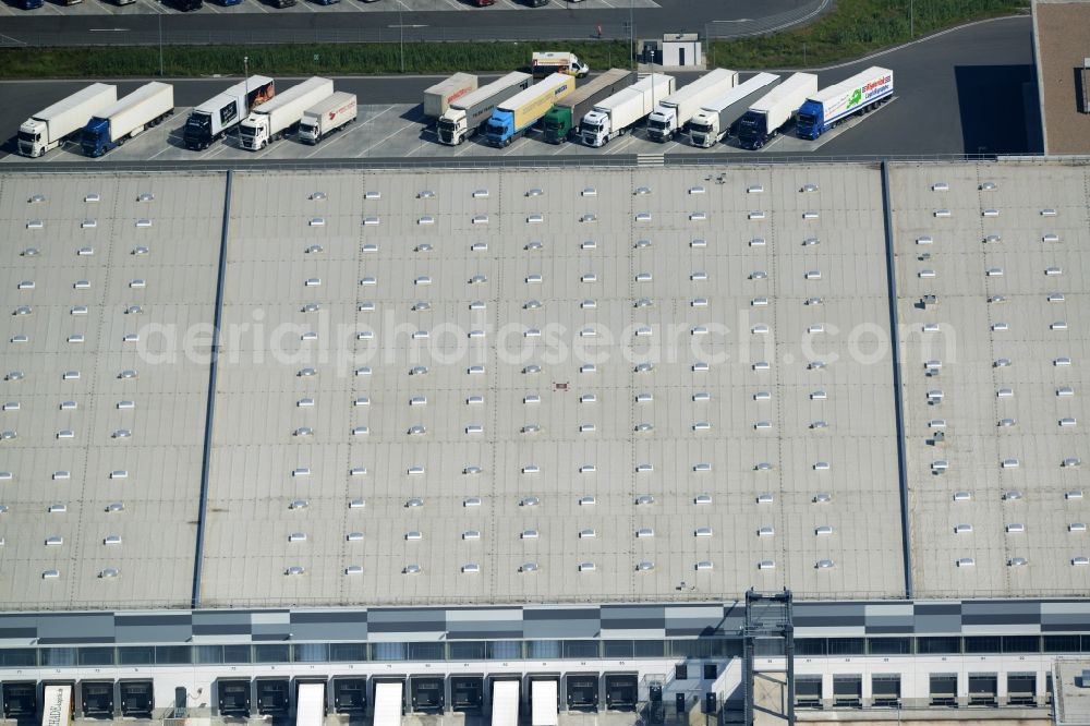 Aerial photograph Bönen - Building complex and grounds of the logistics center and central storage of Kik Textilien GmbH in Boenen in the state of North Rhine-Westphalia. The centre is located in the industrial area in the East of Boenen. It consists of a series of loading docks for trucks