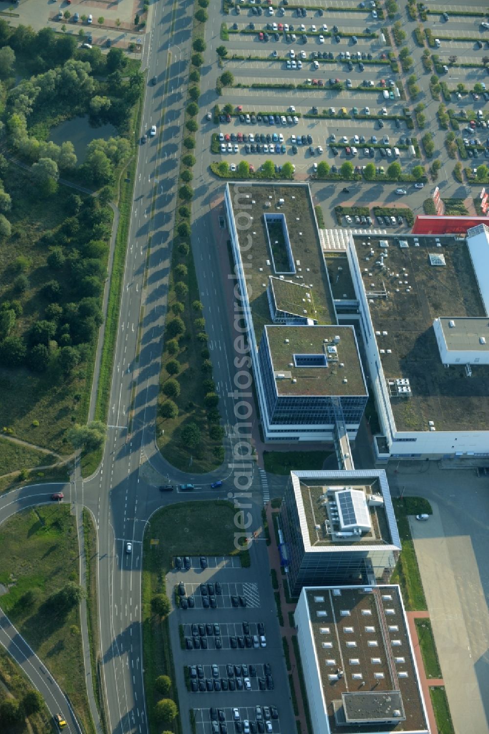 Schönefeld from above - Building of the store - furniture market Hoeffner Berlin-Waltersdorf am Rondell in Waltersdorf in the state of Brandenburg. The building of the store includes a large parking lot in the commercial area