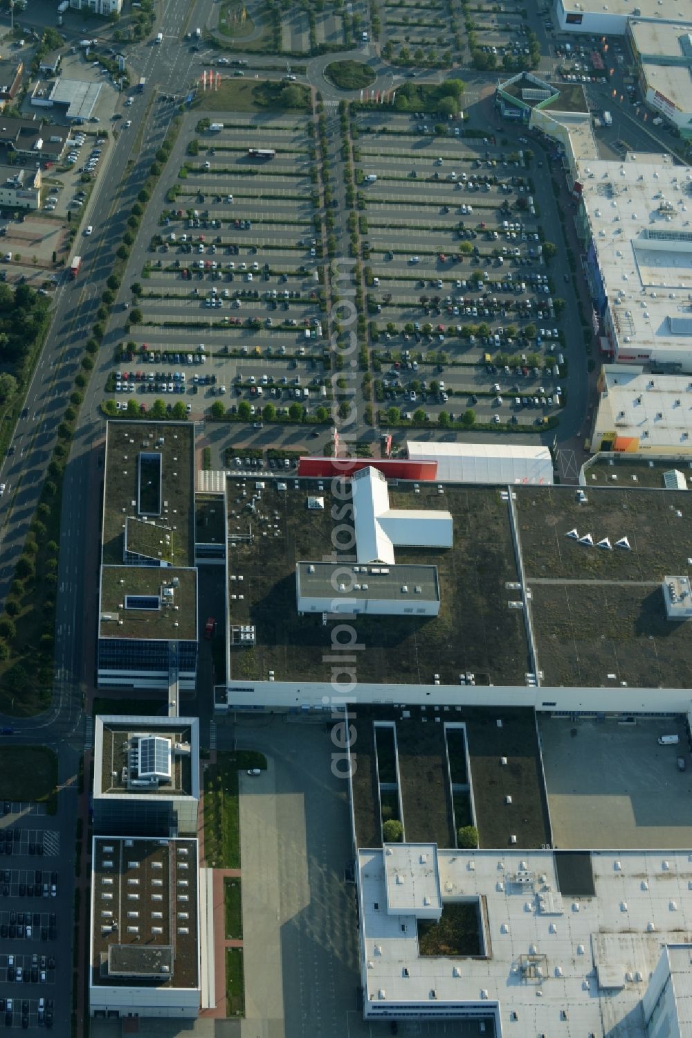 Schönefeld from the bird's eye view: Building of the store - furniture market Hoeffner Berlin-Waltersdorf am Rondell in Waltersdorf in the state of Brandenburg. The building of the store includes a large parking lot in the commercial area