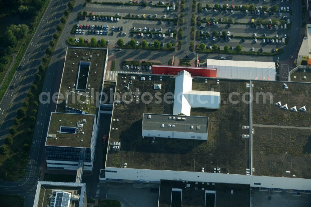 Aerial image Schönefeld - Building of the store - furniture market Hoeffner Berlin-Waltersdorf am Rondell in Waltersdorf in the state of Brandenburg. The building of the store includes a large parking lot in the commercial area