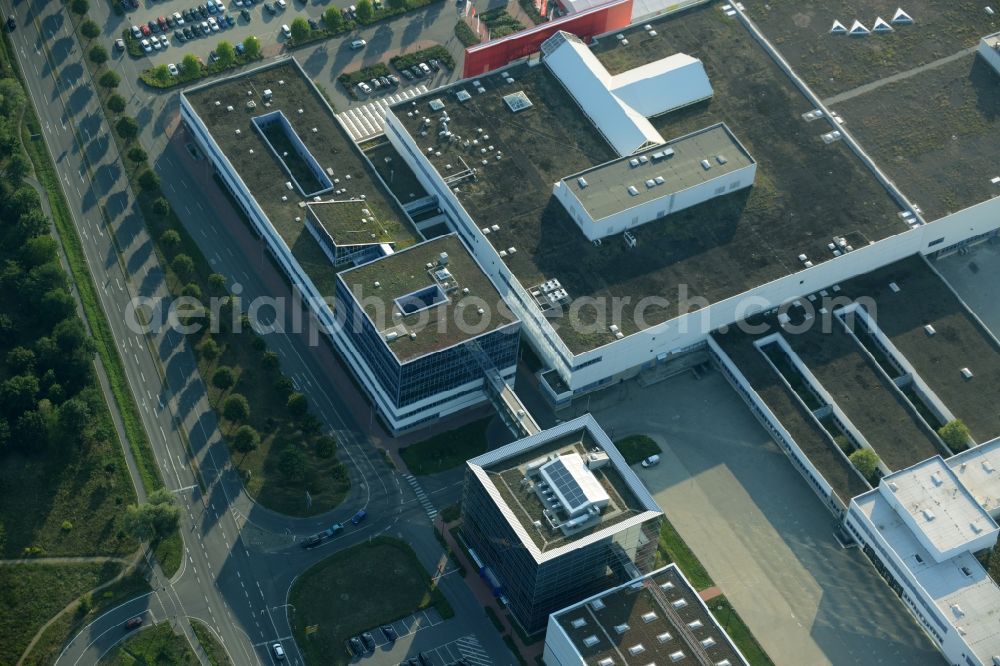 Schönefeld from above - Building of the store - furniture market Hoeffner Berlin-Waltersdorf am Rondell in Waltersdorf in the state of Brandenburg. The building of the store includes a large parking lot in the commercial area