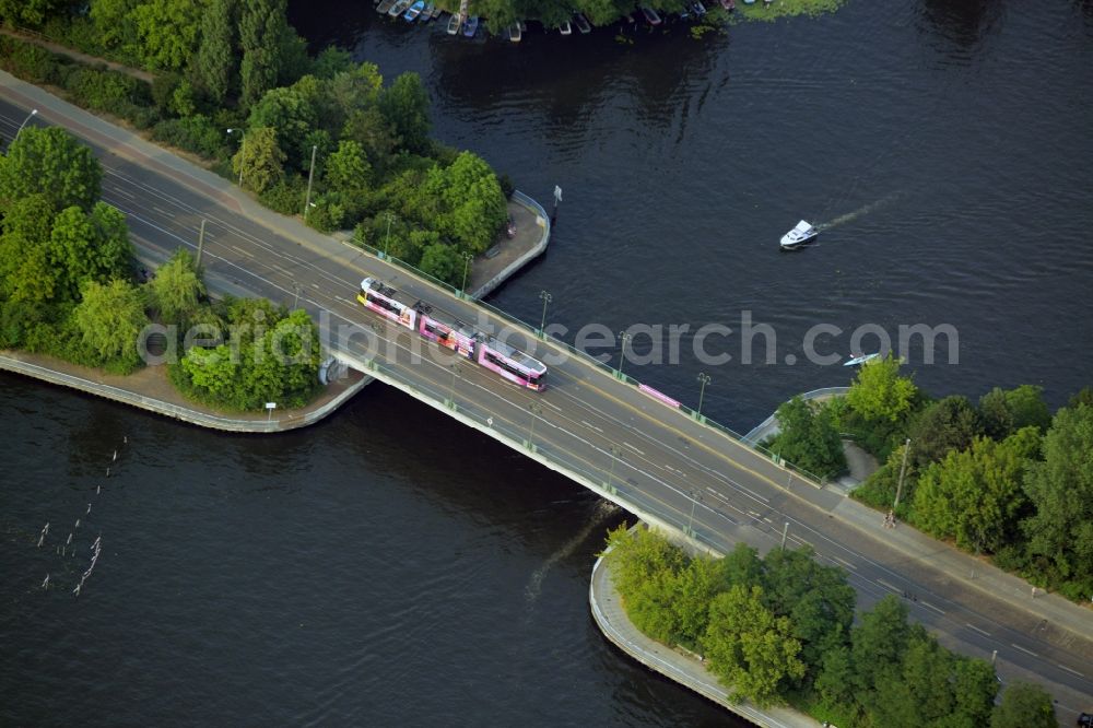 Aerial photograph Berlin - Damm Bridge over the river Spree in the Koepenick part of the district of Treptow-Koepenic in Berlin in Germany. Lindenstrasse street and tram tracks are taking their course over the bridge from the 1980s