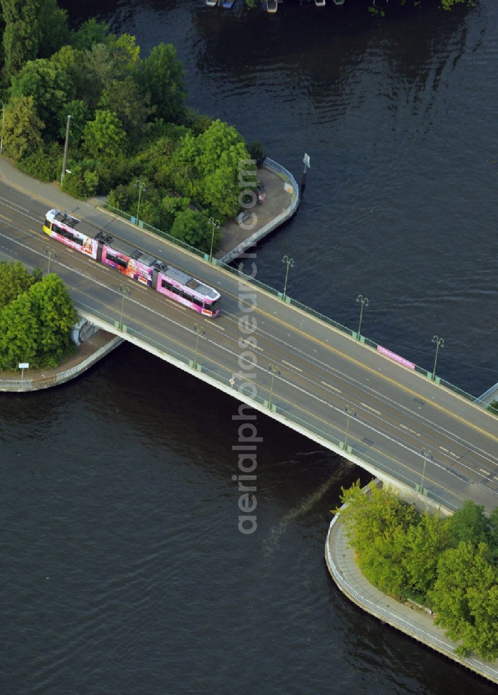 Berlin from the bird's eye view: Damm Bridge over the river Spree in the Koepenick part of the district of Treptow-Koepenic in Berlin in Germany. Lindenstrasse street and tram tracks are taking their course over the bridge from the 1980s