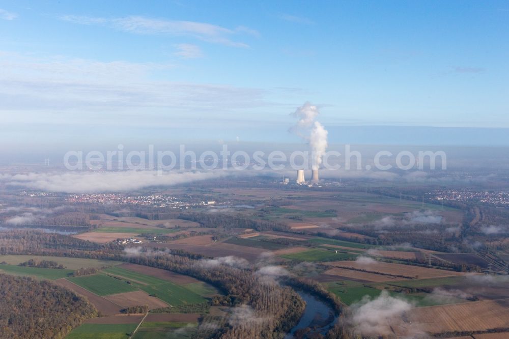 Philippsburg from the bird's eye view: Clouds over the cooling tower of the NPP nuclear power plant of EnBW Kernkraft GmbH, Kernkraftwerk Philippsburg on an Island in the river rhine in Philippsburg in the state Baden-Wuerttemberg, Germany