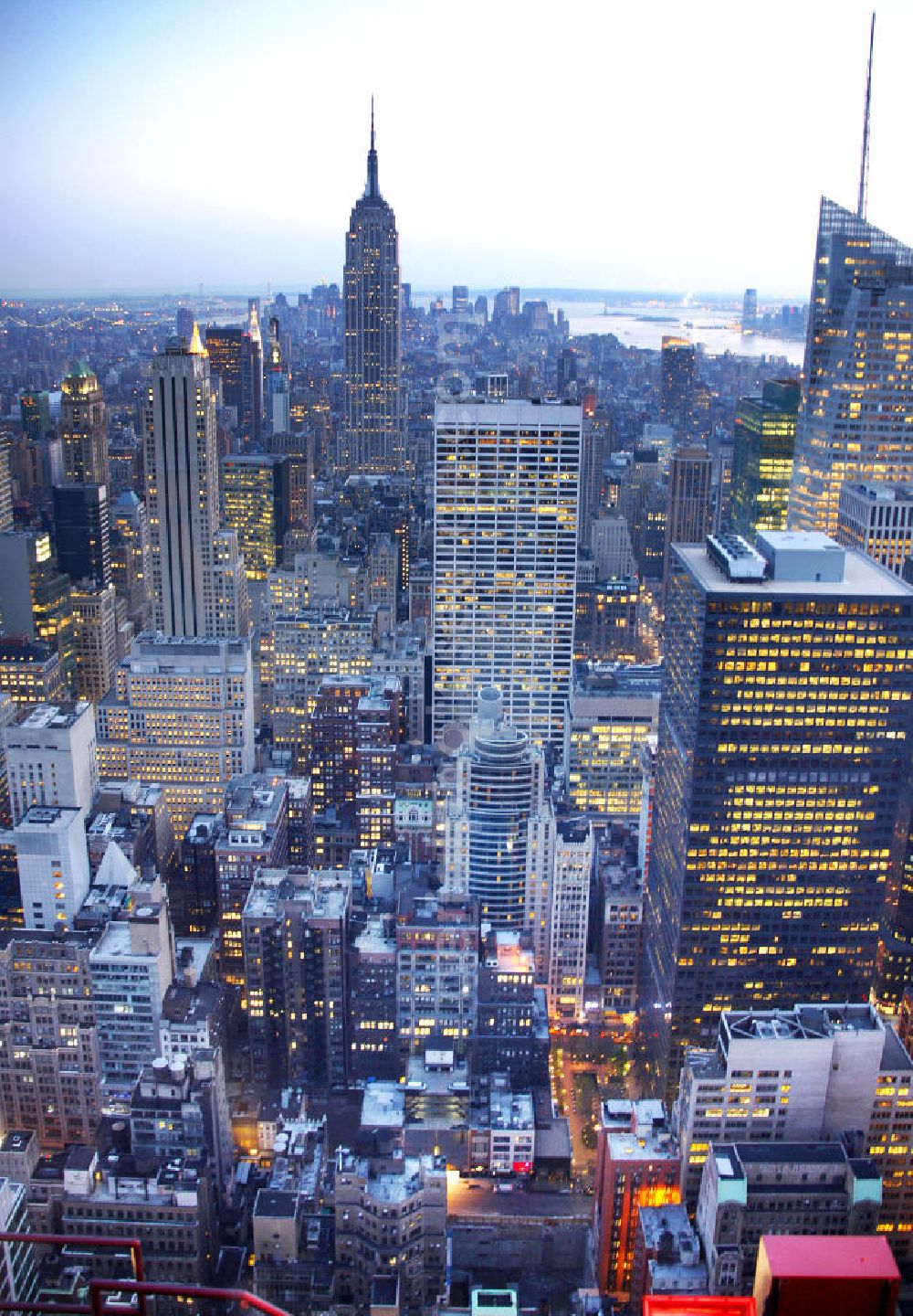 Aerial photograph New York - View of the Midtown centre of New York's borough of Manhattan with the illuminated skyscrapers of the financial district, including the Empire State Building and the Bank of America Tower