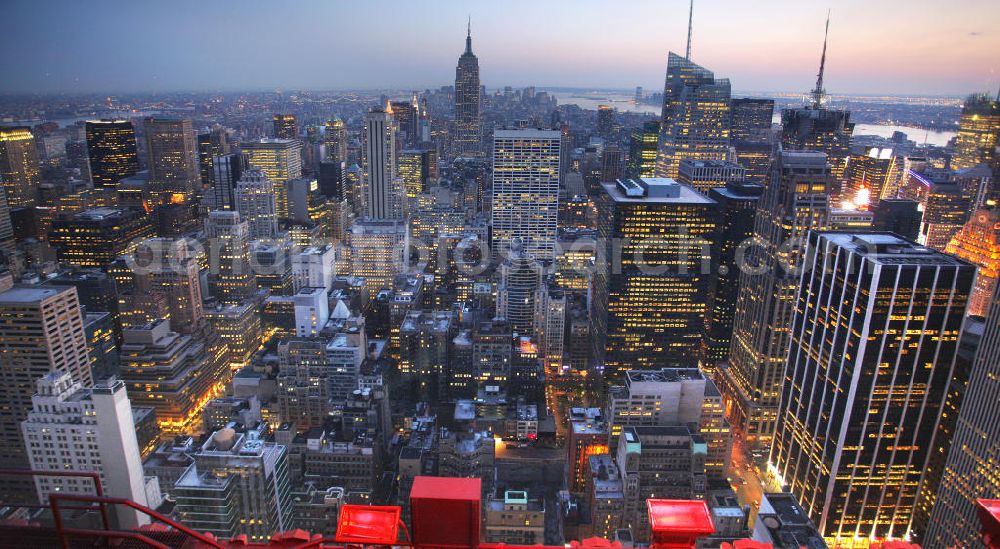 New York from above - View of the Midtown centre of New York's borough of Manhattan with the illuminated skyscrapers of the financial district, including the Empire State Building and the Bank of America Tower