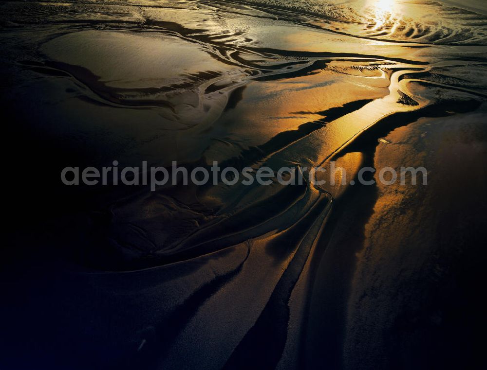 Aerial photograph Cuxhafen - View of the Wadden Sea at Cuxhaven that is illuminated bythe setting sun. It is a part of the Wadden Sea National Park