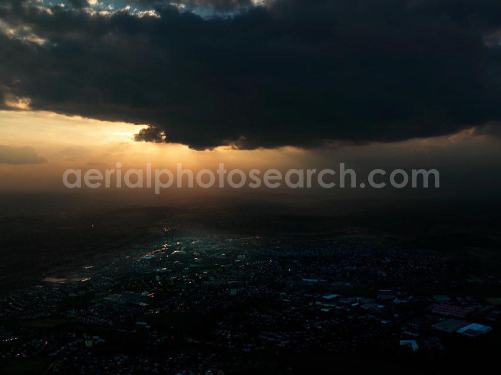 Fulda from above - View of the town of Fulda that is illumed by the evening sun breaking through the clouds. Fulda is the district town of the Fulda county