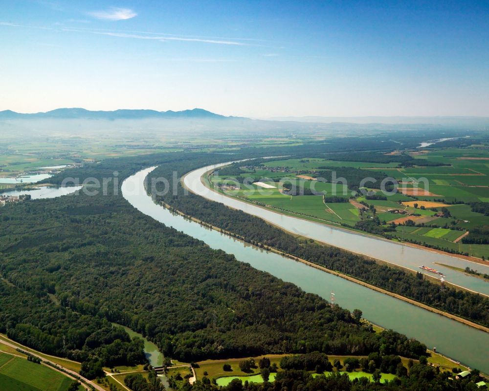 Schwanau from above - The floodplain forest Taubergiessen near Schwanau in the state of Baden-Wuerttemberg. The region belongs to the borough-free area of Rheinau and is located on the Eastern riverbank of the Rhine which marks the border with France here. View from the North towards the South to the mountain range Kaiserstuhl