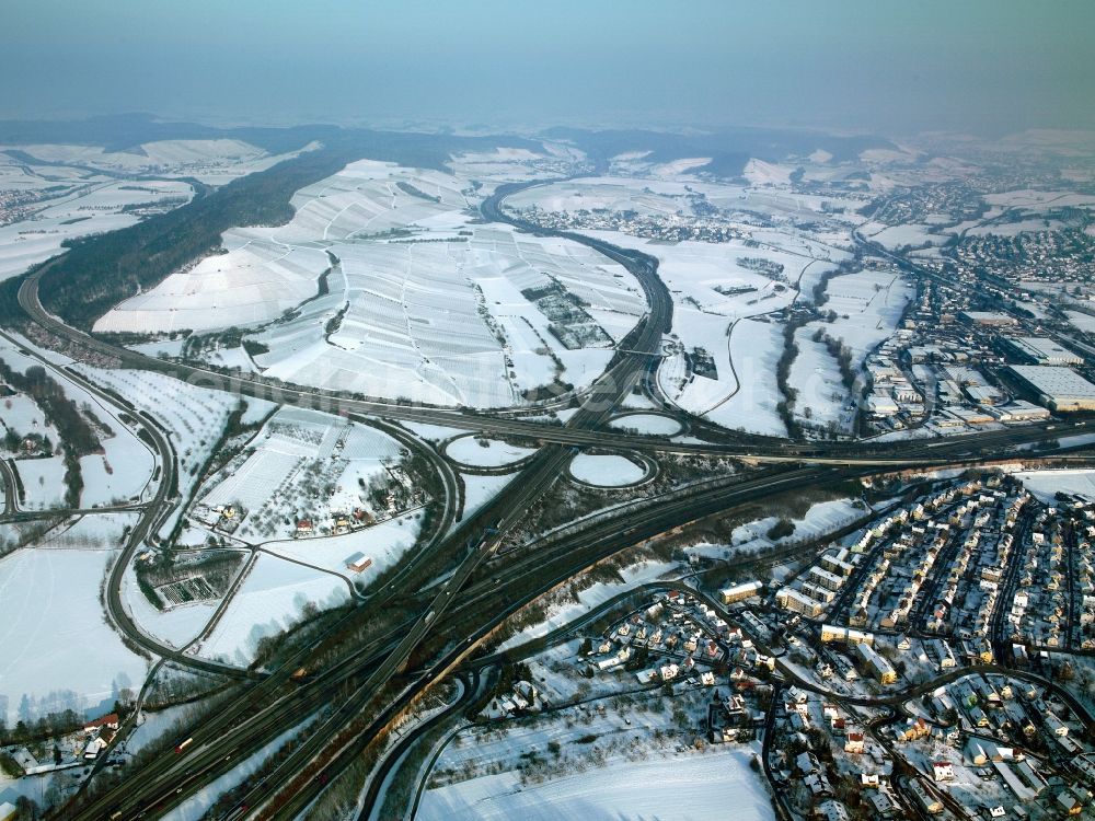 Weinsberg from the bird's eye view: The motorway junction Weinsberg at the city of Weinsberg in the state of Baden-Württemberg. It connects the A6 and A81. It is one of the main interchanges connecting the motorway North and South. The interchange, which is a variation of the clover leaf intersection, was built between 1966 and 1970. It is located in the winterly valley of the river Sulm