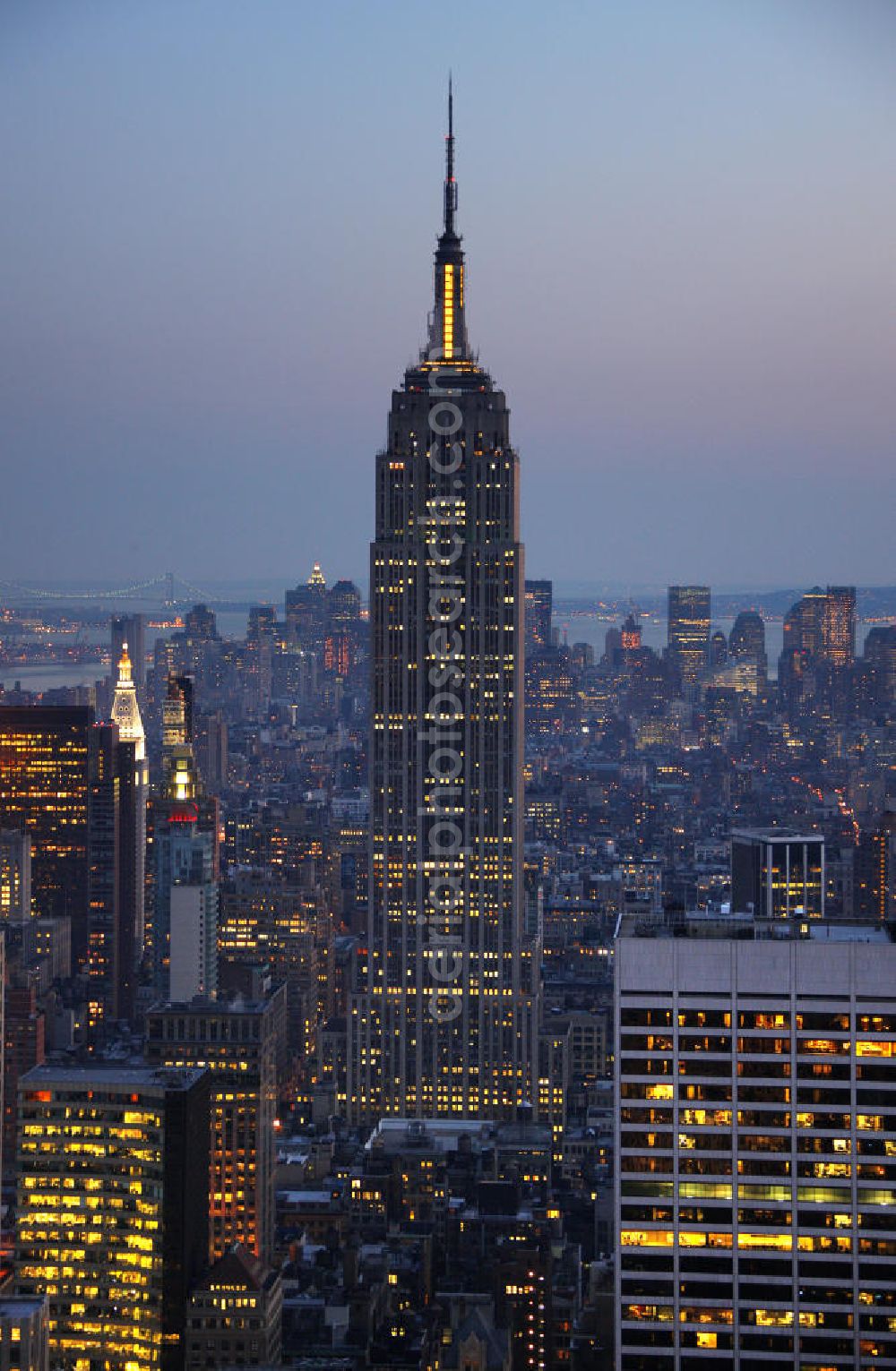 Aerial photograph New York - View of the Empire State Building, a skyscraper in Manhattan in New York City. The rooms of the 102 floors of the Empire State Building will be used primarily for commercial purposes. In the open area in the 86th Floor and in the 102nd Floor are publicly accessible viewing platforms, which are among others the most visited tourist attractions. The building was designed by the New York architectural company of Shreve, Lamb and Harmon