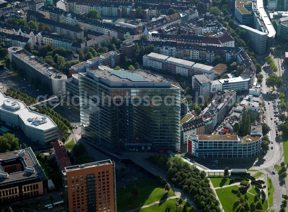 Düsseldorf from above - The office tower Stadttor in the Unterbilk part of Düsseldorf in the state of North Rhine-Westphalia. It was designed by the architects Petzinka, Overdiek and Partner and is home and seat of the prime minister of North Rhine-Westphalia. It is located in the government district of the city and was opened in 1998. The distinct red building next to it is the Portobello tower, another office building built by the architects Döring, Dahmen, Joeressen