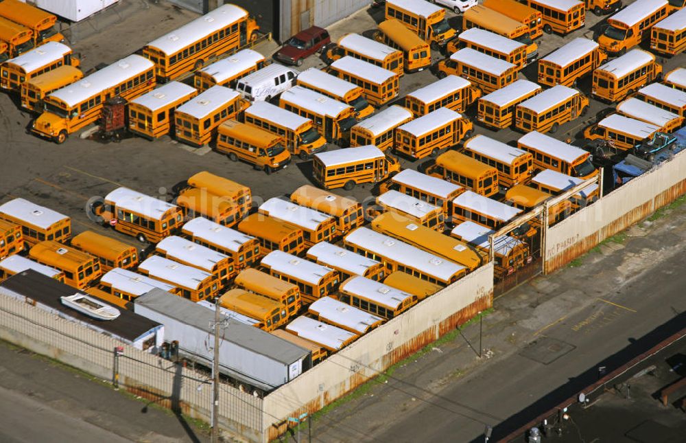 Aerial photograph New York - View on a bus and school bus depot in the Stillwell Avenue on Coney Iceland. The district is located at Coney creek in the New York City borough of Brooklyn. The depot could soon give way to a hotel to increase the value of Coney Iceland