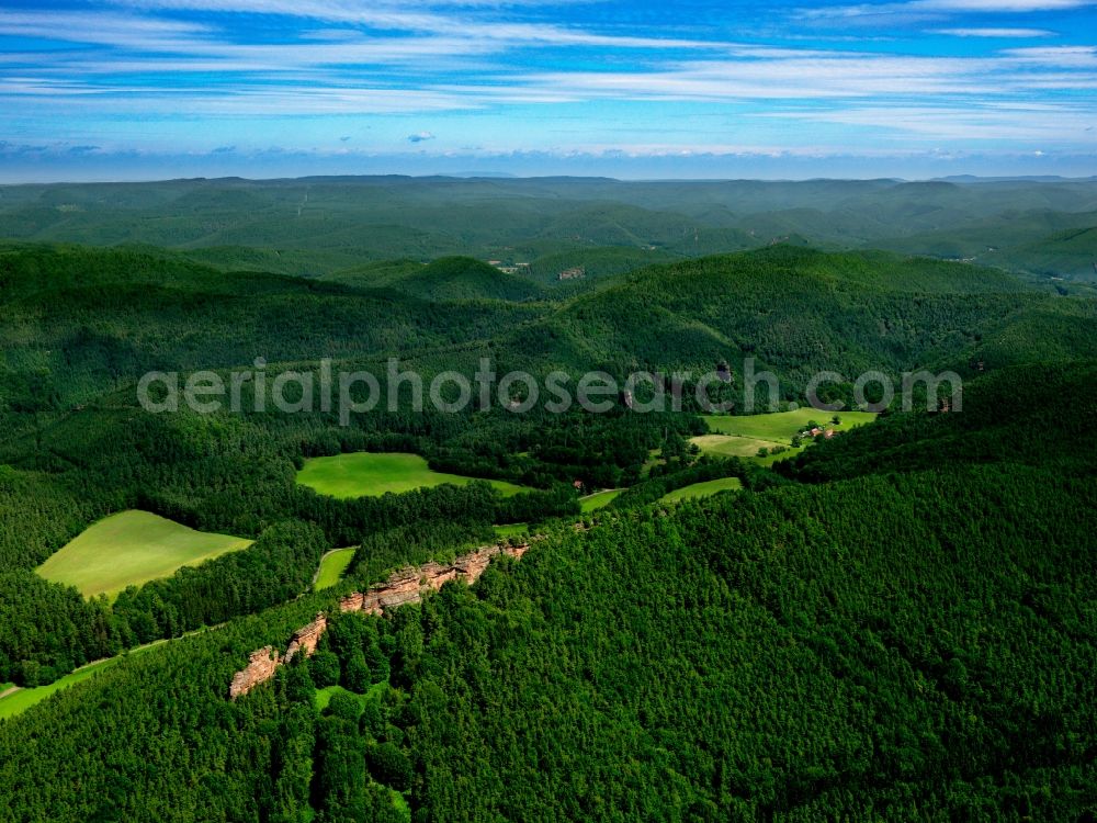 Dahn from the bird's eye view: The Dahn Rockland in the county of Südwestpfalz in the state of Rhineland-Palatinate. County capital is the city of Dahn. The region belongs to the Southern Palatinate Forest, characterised by hills, woods and the name-giving rocks. It is a favoured tourist site because of its various ruins, castles and rock climbing facilities