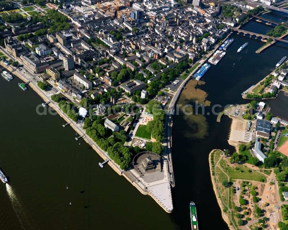 Koblenz from above - Deutsches Eck (German Corner) in Koblenz in the state of Rhineland-Palatinate. The corner is an artificial headland where the Moselle joins the Rhine. It is the city's landmark