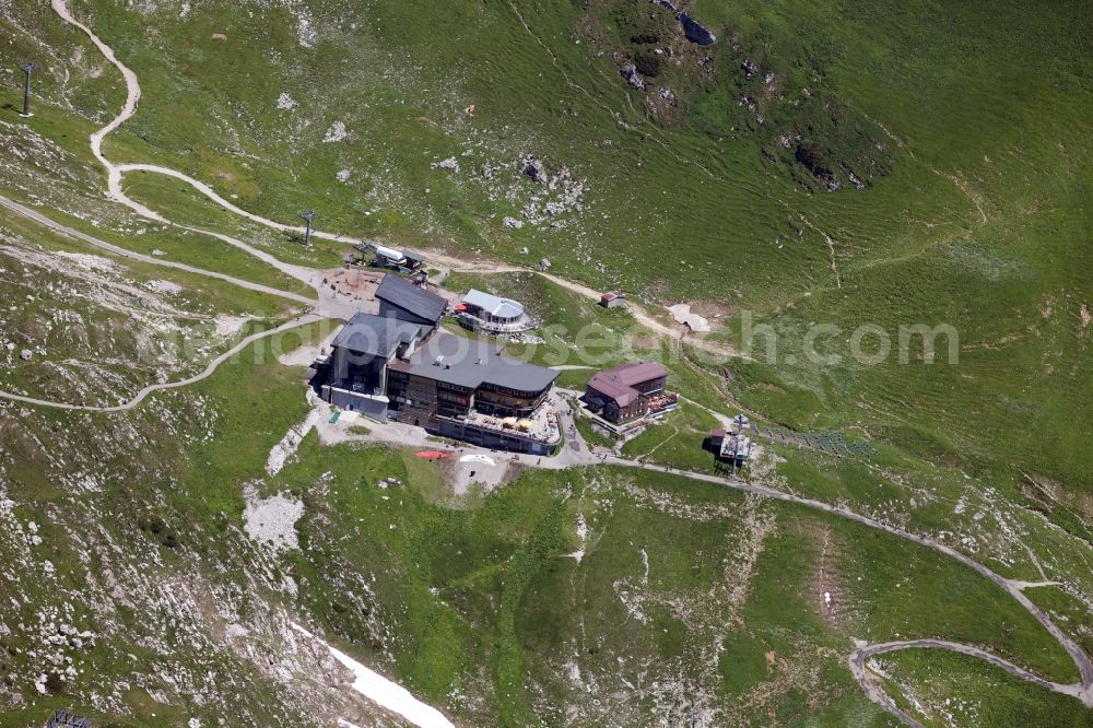 Oberstdorf from above - View of the Edmund-Probst-Haus in Oberstdorf in the state Bavaria. It is located on the mountainside of the Nebelhorn in the Allgaeu Alps next to a station of the Nebelhorn cable car. Owner is the Deutsche Alpenverein e.V. (DAV)