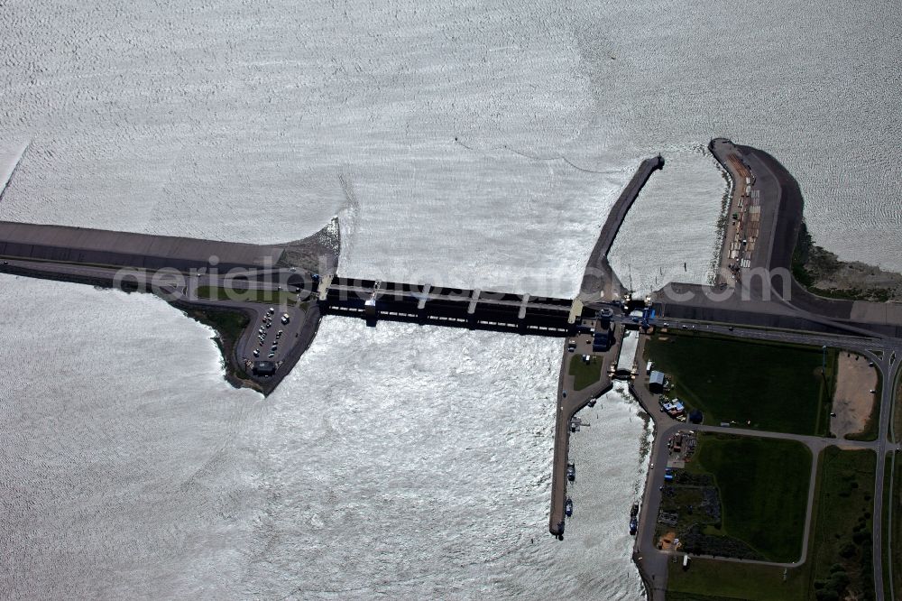 Tönning from the bird's eye view: The Eider flood barrier in Tönning in the state of Schleswig-Holstein. The barrage is located on the mouth of the river Eider, going into the North Sea. The barrier is in place for protection against storm flooding of the North Sea. It was built in 1967, consisting of 2 rows with 5 gates each to provide double flooding protection