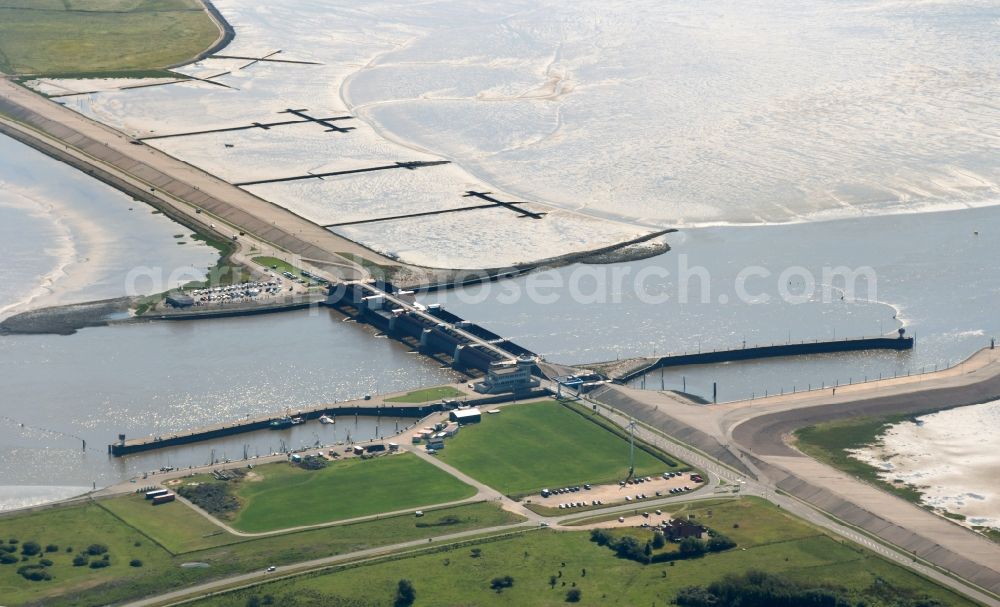 Aerial photograph Tönning - The Eider flood barrier in Toenning in the state of Schleswig-Holstein. The barrage is located on the mouth of the river Eider, going into the North Sea. The barrier is in place for protection against storm flooding of the North Sea. It was built in 1967, consisting of 2 rows with 5 gates each to provide double flooding protection