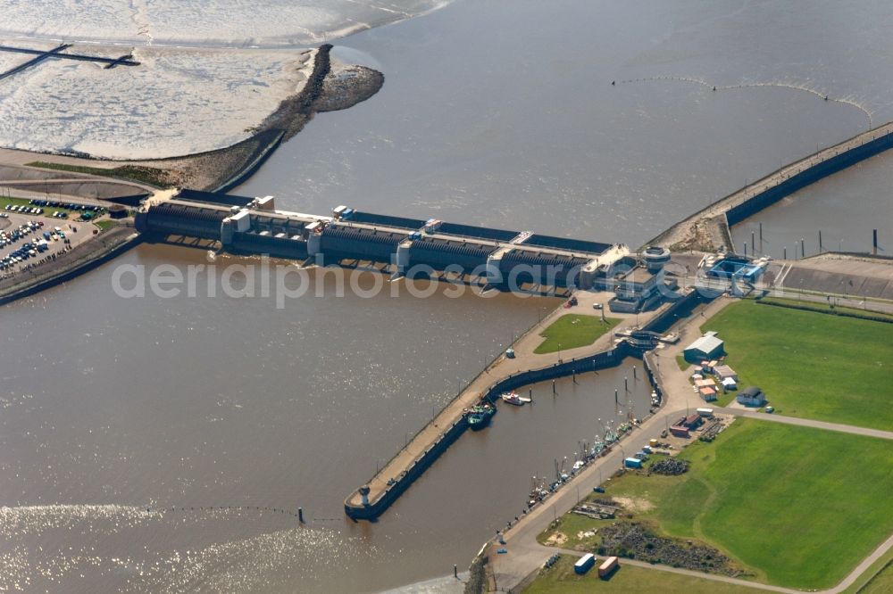 Aerial image Tönning - The Eider flood barrier in Toenning in the state of Schleswig-Holstein. The barrage is located on the mouth of the river Eider, going into the North Sea. The barrier is in place for protection against storm flooding of the North Sea. It was built in 1967, consisting of 2 rows with 5 gates each to provide double flooding protection