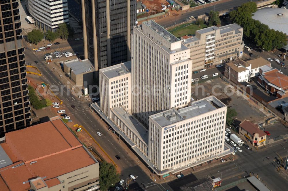 Aerial photograph JOHANNESBURG - The Eskom Center in Johannesburg, South Africa. The skyscraper is located in the central business district of the city and it was the former headquarter of the electricity producer Eskom until 1980. Behind the Eskom Center lies the Logistics House, the former headquarter of the airline company South African Airways