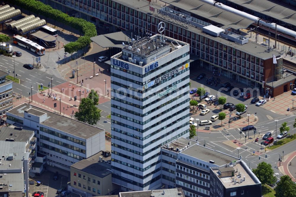 Bochum from the bird's eye view: The Europahaus in the city center of Bochum in the state of North Rhine Westphalia. The tower is located opposite the Bochum central train station. It is home to the first medical specialist center in the city of Bochum. Recognisable is also the turning Mercedes Benz star on the roof as well as the luminous advertisment of the Lueg car dealership