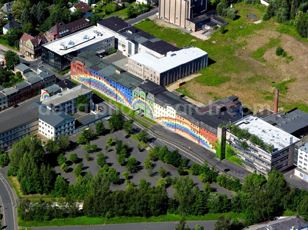 Selb from the bird's eye view: The building of the Rosenthal AG company in the town of Selb in the state of Bavaria. The facade was designed and painted in 1973 by the artist Otto Piene. The wall painting is 195 metres long and 18 metres high. The building is also called the Rainbow House and is a landmark of the porcellain producer and the town