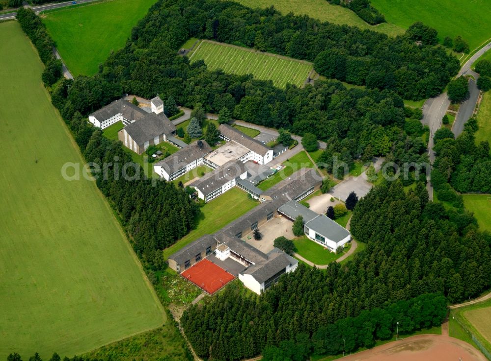 Hürtgenwald from above - The monastery Vossenack acting since 1967 as a school and boarding school. The monastery was built in 1960 next to the cemetery in the woods