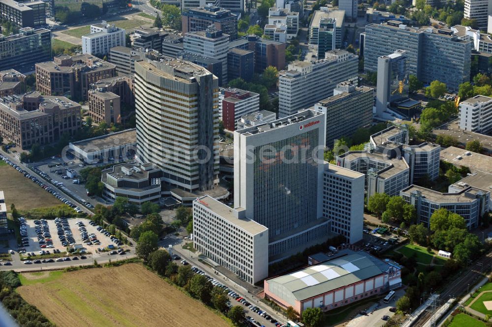 Eschborn from above - View at the commercial area in Eschborn with the Vodaphone building, which has formerly been the headquarter of Arcor, the branches of Deutsche Bank, Telekom, Samsung, and of the German stock exchange. In the foreground are railroad tracks