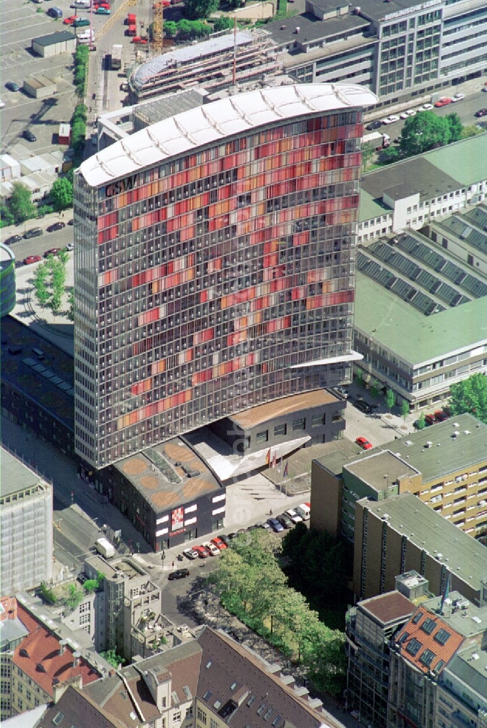 Berlin Kreuzberg from the bird's eye view: The GSW-building was constructed by Sauerbruch Hutton and is the advanced headquarters of the Charitable Settlement and Housing Corporation Berlin. The curved facade from the fourth floor will contribute to reducing energy needs, as well as the second curtain wall on the west side, which is equipped with shutters in various shades of red