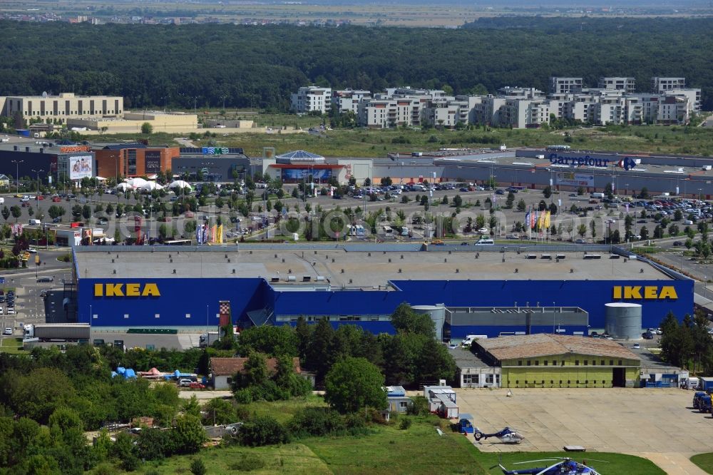 Aerial image Bukarest - The IKEA furniture store in the Baneasa Shopping City in the North of Bucharest. The distinct blue building of the Swedish company is located in the North of the Romanian Capital, adjacent to the Baneasa International Airport and within the compound of Baneasa Shopping Center. The yellow building in the background is the embassy of the USA