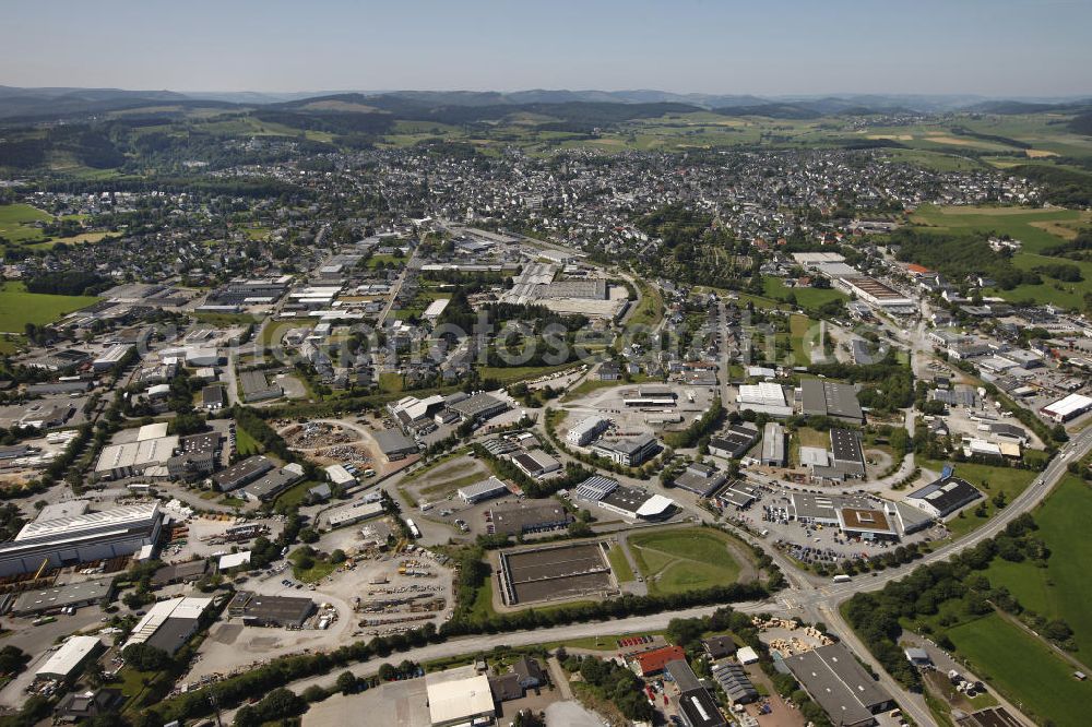 BRILON from the bird's eye view: Look at the industrial area An Den Vier Linden and the Keffelker road in Brilon. The core city can be seen in the background