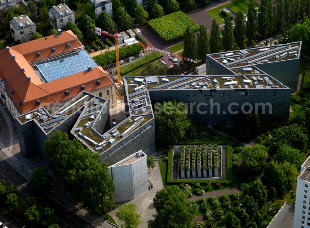 Aerial image Berlin - View of the Jewish Museum in Berlin. The museum building in Linden Street in Berlin's Kreuzberg district combines the baroque old part of the college building (the former seat of the High Court) with a new building. This zigzag structure is based on a design by architect Daniel Libeskind. The museum houses a permanent exhibition, several temporary exhibitions, archives, library and research facilities
