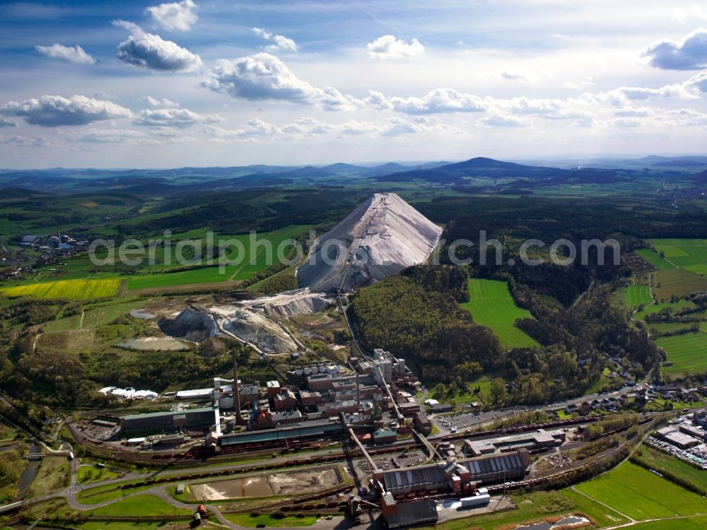 Philippsthal (Werra) from the bird's eye view: The potash works Hattorf in Philippsthal in the state of Hesse. The overburden pile is widely visible as an artificial, white hill in the landscape. East of it, the potash works facilities with its factories and industrial sites is located. The compound belongs to the Werra network, was originally built in 1905 and is run by K+S Kali GmbH