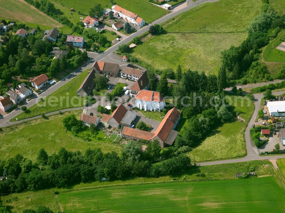 Bolanden from above - The monastery Hane before 1129 was founded by the noble family of Bolanden. After the destruction of the monastery, it was commissioned by Emperor Barbarossa in 1160 rebuilt and enlarged. The monastery is now located on the outskirts of town