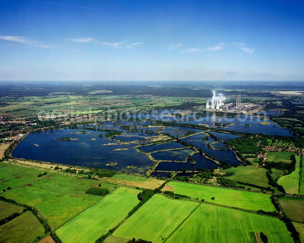 Aerial photograph Peitz - The power station Jänschwalde on the ponds of Peitz in Peitz in the state of Brandenburg. The thermal power station is run with brown coal and located East of the ponds and waters. The large pond in the foreground is the Teufelsteich devil's pond. The ponds are used for fishing