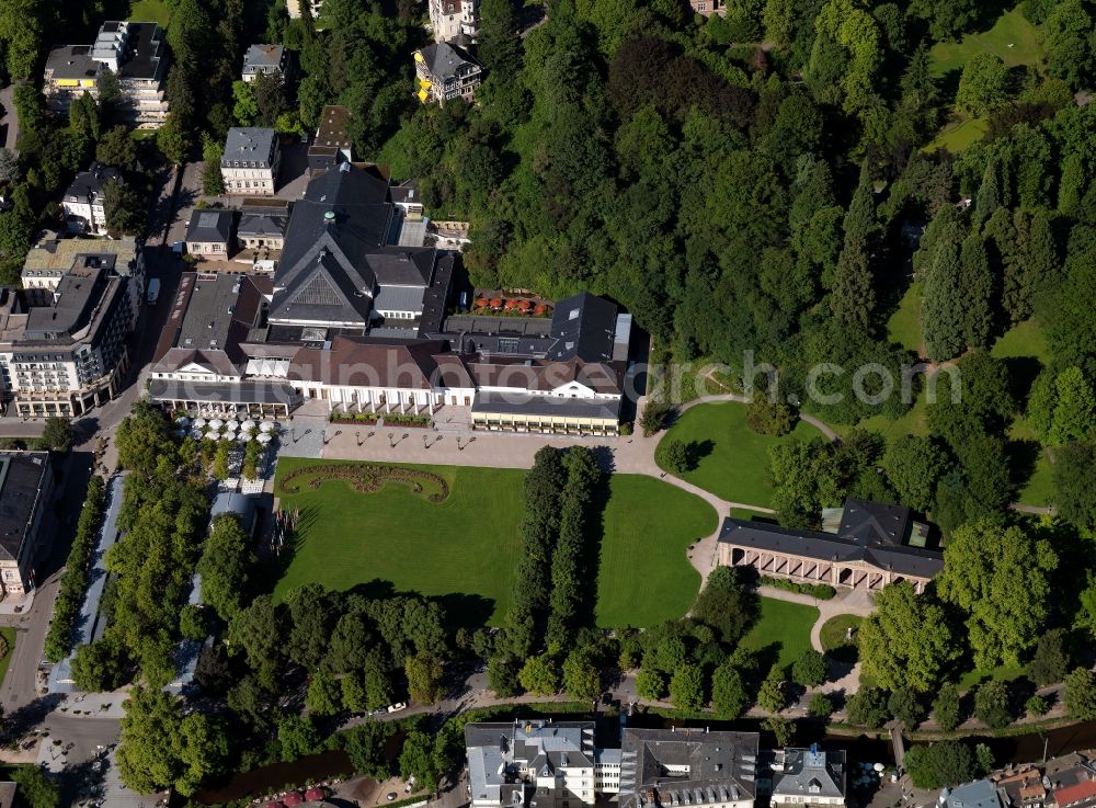 Baden-Baden from the bird's eye view: The health resort and cure park in the city of Baden-Baden in the state of Baden-Württemberg. The building was design in classicistic fashion and is today used as event site and concert venue. The Kurhaus is surrounded by historical buildings, the park and woods