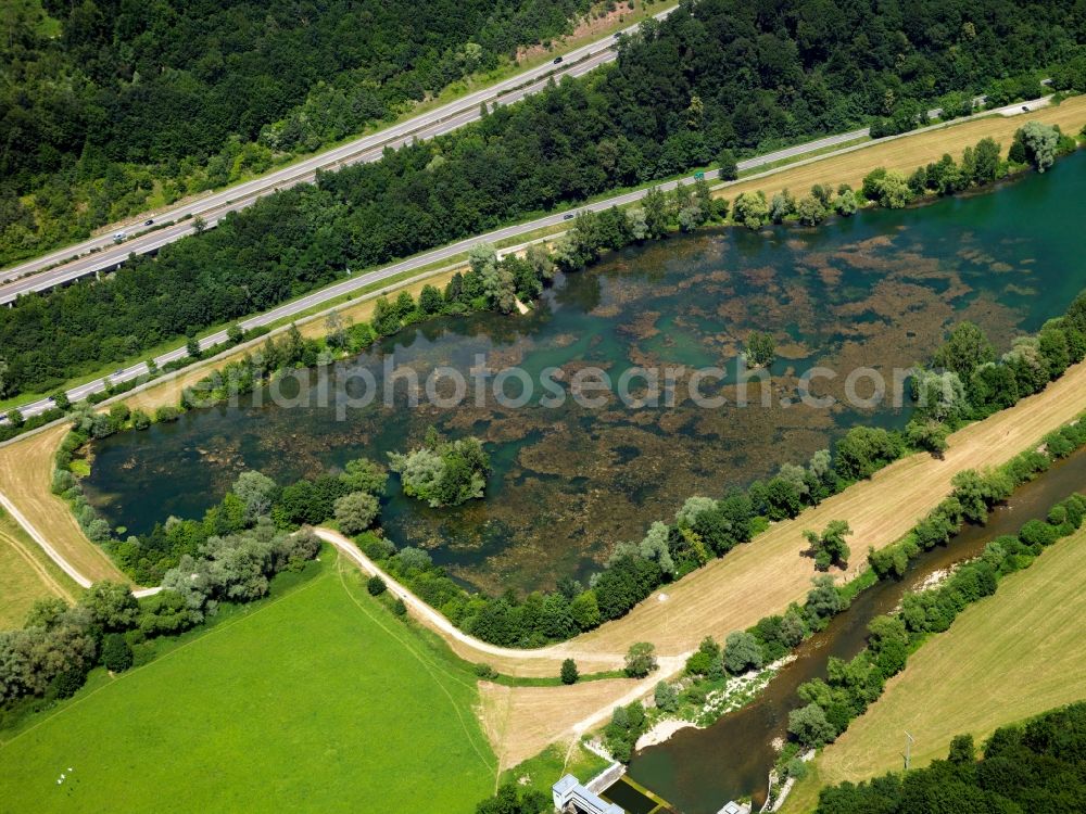 Kirchentellinsfurt from above - The channel of the river Neckar in the county of Kirchentellinsfurt in the state of Baden-Württemberg. Located in the Neckar valley, a small dam and channel build a recreational area as well as two small lakes filled with water from the river. The larger one of the lakes is the quarry pond Epple