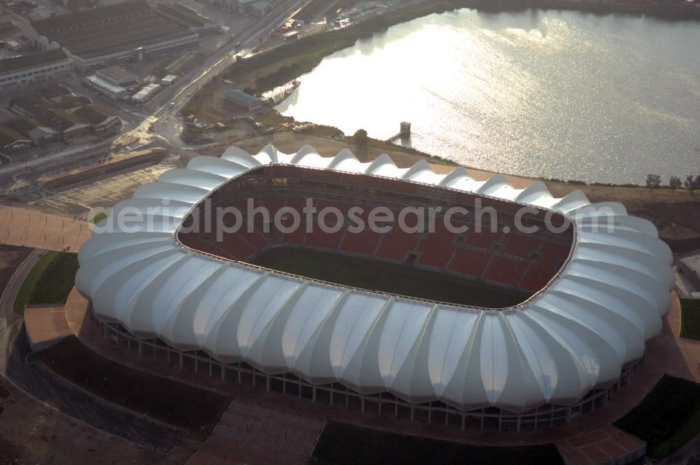 Aerial photograph Port Elizabeth - Blick auf das Nelson - Mandela - Bay - Stadion in Port Elizabeth in der Provinz Eastern Cape in Südafrika vor der Fußball-Weltmeisterschaft 2010. Der architektonische Entwurf stammt vom deutschen Architekturbüro Gerkan, Marg und Partner (gmp), die Tragwerksplanung für das Dach erfolgt durch Ingenieurbüro Schlaich, Bergermann und Partner. Das Stadion steht am North End Lake. View of the Nelson-Mandela-Bay-Stadium in Port Elizabeth in South Africa for the FIFA World Cup 2010.