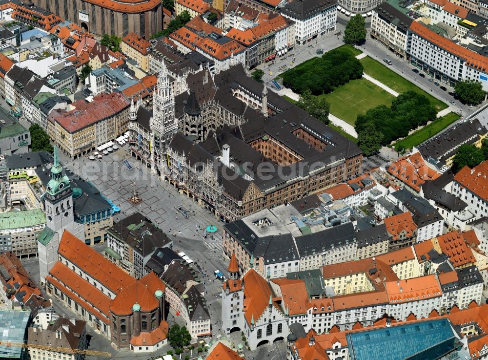 München from the bird's eye view: The new city hall on Marienplatz in the city center of Munich in the state of Bavaria. The seat of the mayor, city council and administration is a landmark of the city and was built around 1900 in a neo-gothic style. It has become famous for its chimes with 43 bells. It is located in the pedestrian area of the city center