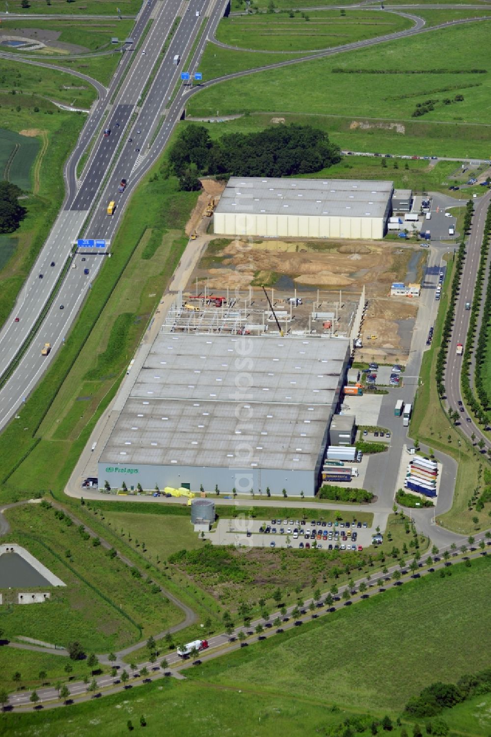 Leipzig from above - The Prologis Germany compound in the Plaußig part of Leipzig in the state of Saxony. The logistics site consits of three halls, a further two are being built currently. The construction site is visible between the existing halls. The vicinity of the airport as well as the adjacent motorway A14 make logistics and transportation easier