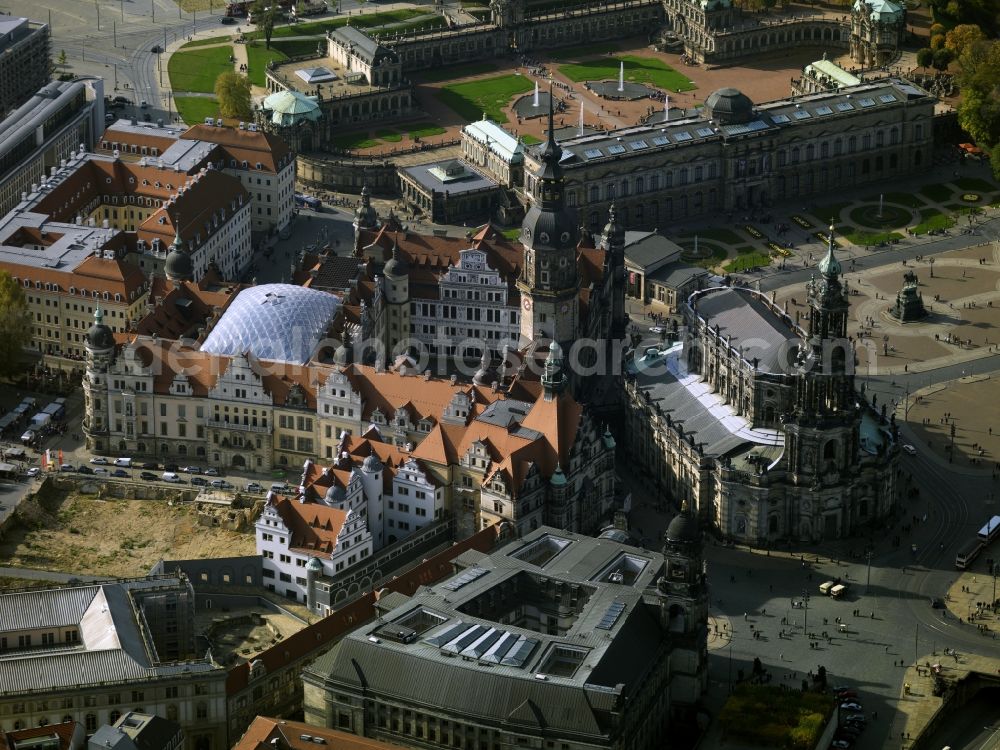 Aerial photograph Dresden - The Royal Palace was the residence of the Saxon electors and kings. It is one of the oldest buildings in the city and architecturally significant as all styles from Romanesque to historicism have taken their toll on the building. Today the castle is home to museums, the Historical and the New Green Vault, the Numismatic and the Cabinet of Prints. Again, the Art Library and the Directorate-General of the Dresden State Art Collections are housed. In addition, there is the Cathedral