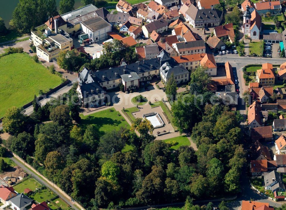 Aerial image Kreuzwertheim - The castle in Kreuzwertheim in the state of Bavaria. The Schloss (palatial castle), once built as a widow's seat, and still the Löwenstein-Wertheim-Freudenberg princely family's seat today, is a prominent feature in the community