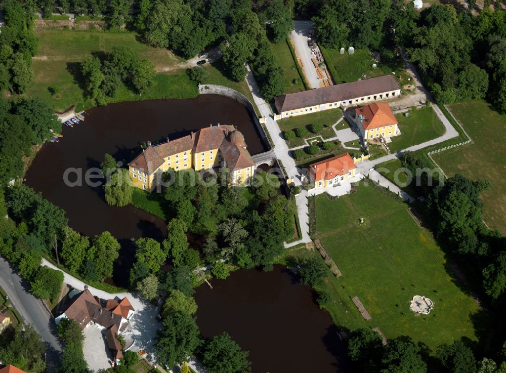 Heroldsbach from above - The palace Thurn in Heroldsbach in the state of Bavaria. The former summer residence is enclosed by trees. The adjacent park was opened in 1975 and includes the fun park Schloss Thurn with about 30 attractions for visitors. The park itself has very old trees with an oak of about 400 years