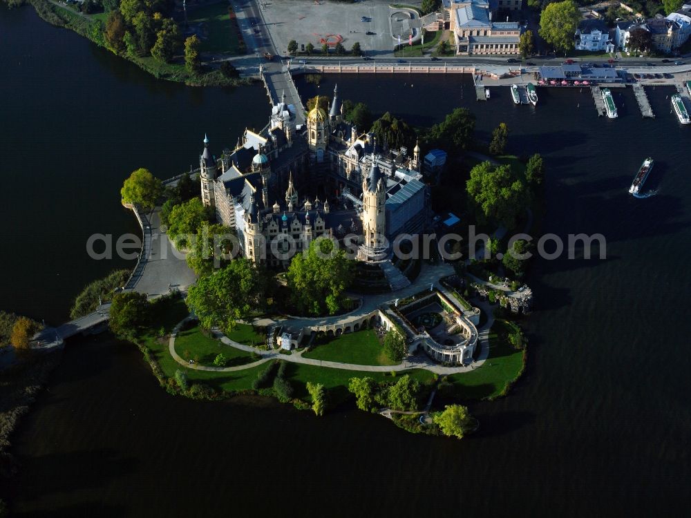 Schwerin from the bird's eye view: Schwerin Castle on the castle island in the city center of Schwerin in the state of Mecklenburg-Vorpommern. The history of the castle can be traced back to a fortress of the 10th century. Its current state stems from the 19th century, it is considered one of the main buildings of the romanticism. It is also called the Neuschwanstein of the North and is the seat of the parliament of the state of Mecklenburg-Vorpommern