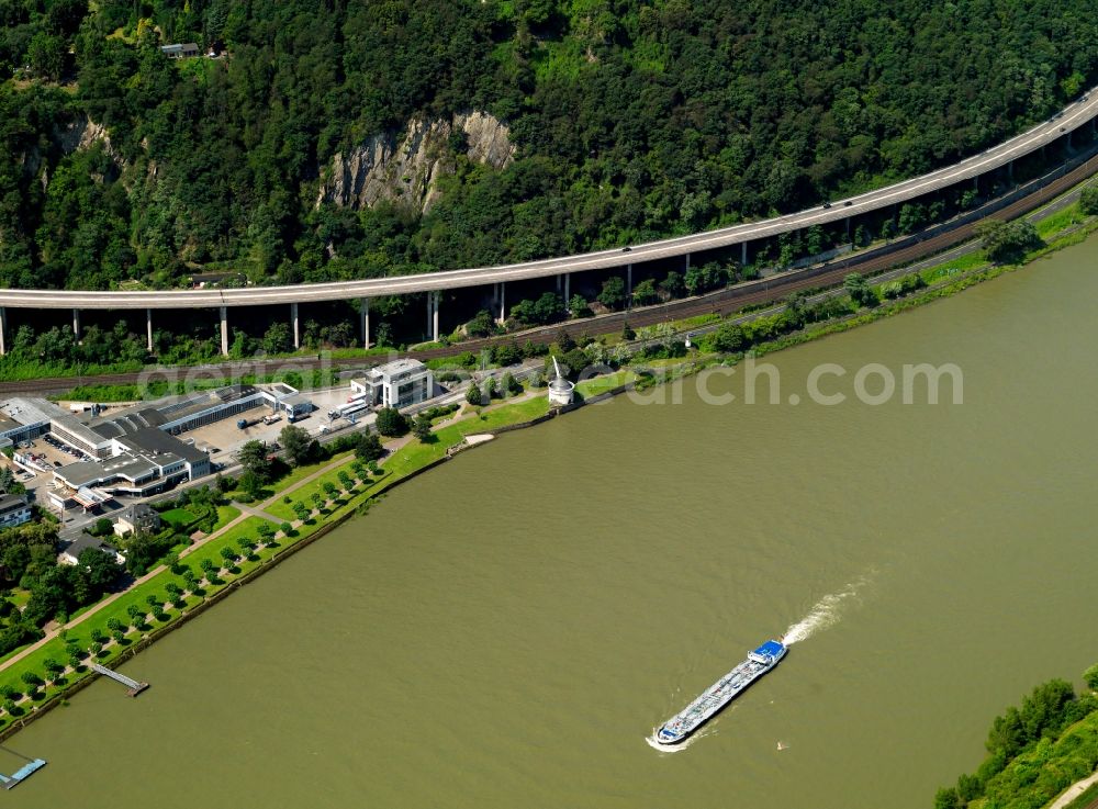 Aerial photograph Andernach - The southern riverbank of the Rhine and the Old Crane at the western town limits of Andernach in the state of Rhineland-Palatinate. The Alte Krahnen is an old port and tower crane from the 16th century. The stone building is located below the Autobahn A9. It is one of the landmarks of the town and a seldom example of an industrial landmark of the Renaissance era