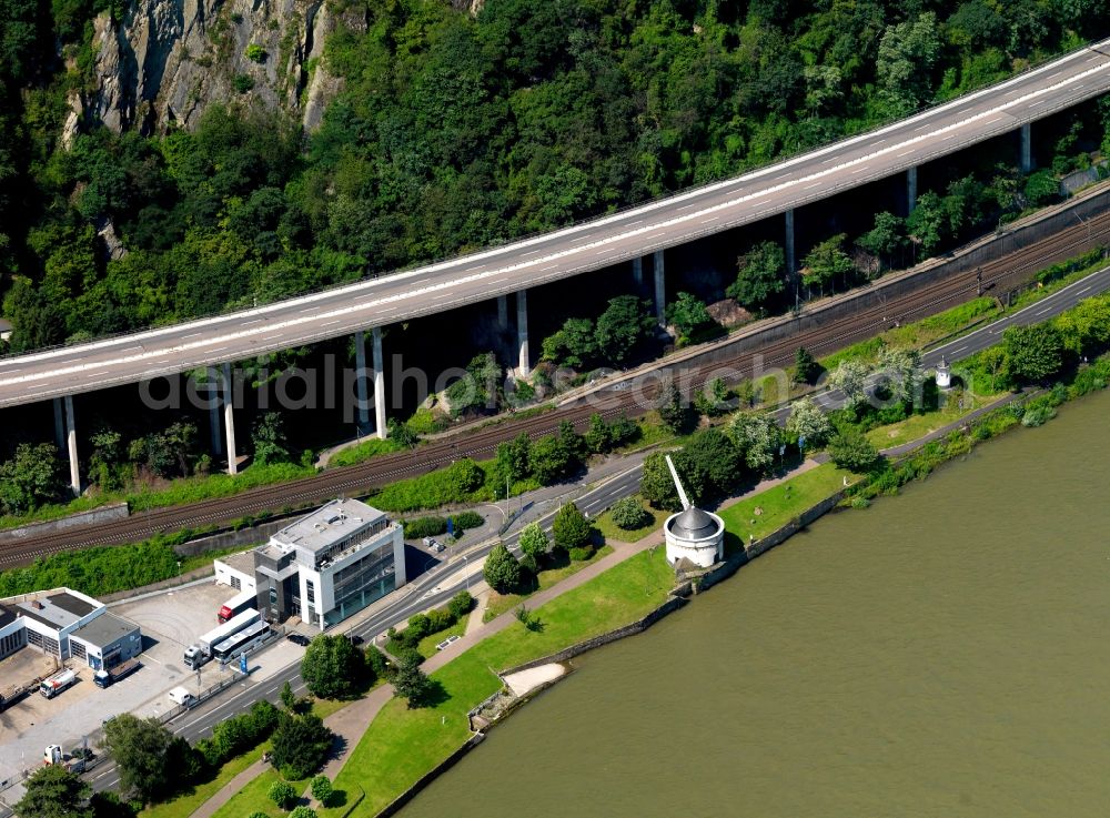 Andernach from above - The southern riverbank of the Rhine and the Old Crane at the western town limits of Andernach in the state of Rhineland-Palatinate. The Alte Krahnen is an old port and tower crane from the 16th century. The stone building is located below the Autobahn A9. It is one of the landmarks of the town and a seldom example of an industrial landmark of the Renaissance era