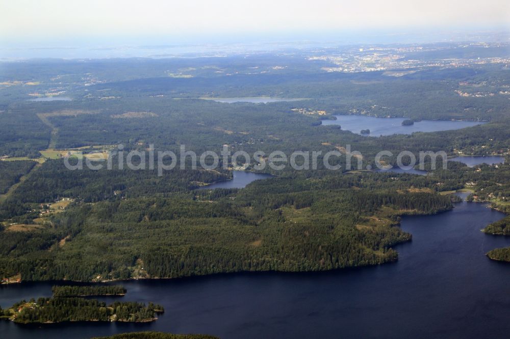 Aerial image Mölnlycke - Lakes and forests in the Greater Gothenburg at Moelnlycke in Sweden. The landscape and the forests are crossed by a path for the current route for energy supply in southern Sweden 