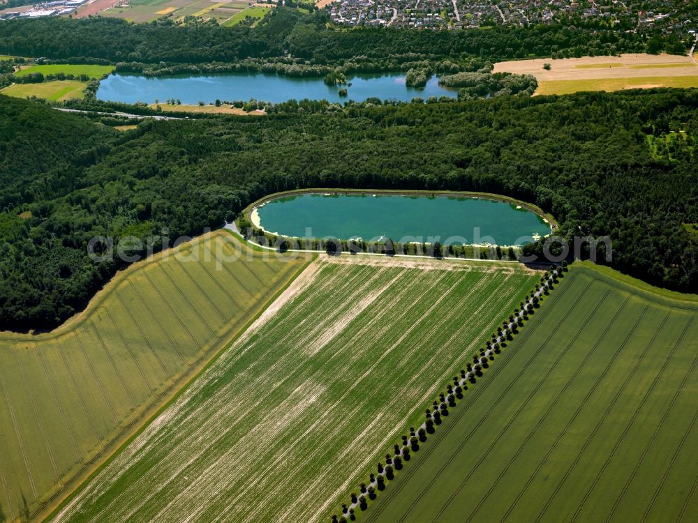 Aerial image Tübingen - The water reservoir in the Pfrondorf part of the city of Tübingen in the state of Baden-Württemberg. The reservoir is located amidst fields on the edge of a wood in the North Eastern part of the town